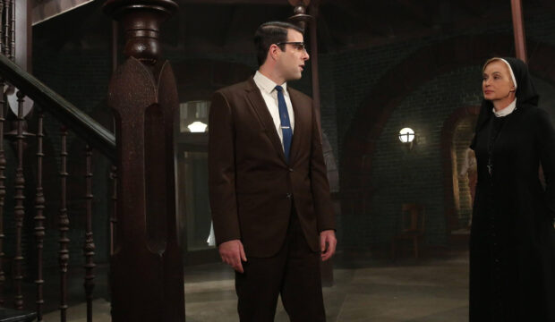 A man in a suit talks to Jessica Lange dressed as a nun in an old building, 2K Desktop Wallpaper