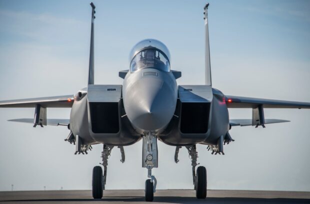 A jet fighter stands on the runway ready for takeoff under clear sky, HD Desktop Wallpaper