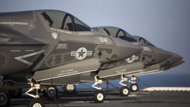 Three jet fighters are lined up on the deck of an aircraft carrier, showing detailed markings and nose sections, HD Desktop Wallpaper PC Wallpaper