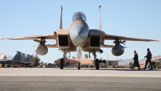 A jet fighter is positioned on the runway with pilots and crew preparing for flight, HD Desktop Wallpaper