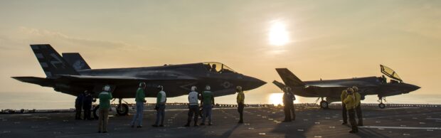Military personnel standing near jet fighter during sunset on aircraft carrier, 4K Desktop Wallpaper