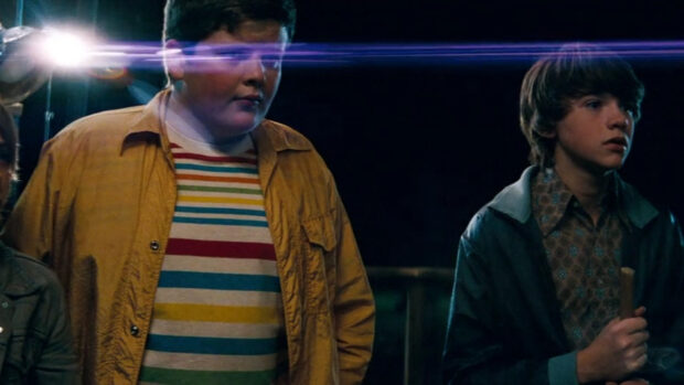 Two boys stand in a dark setting with a bright light shining, HD Desktop Wallpaper