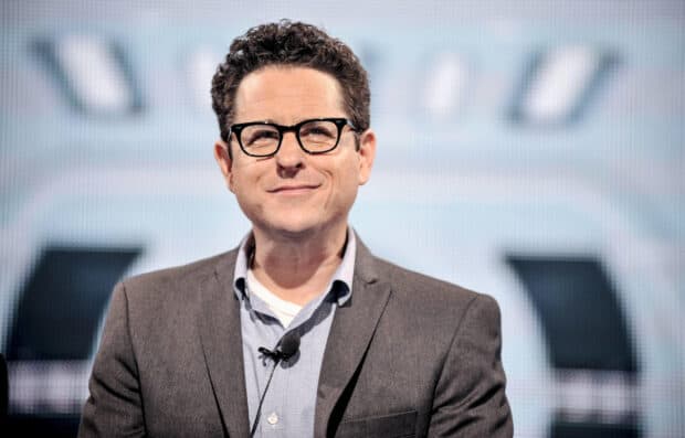 Jj Abrams smiles confidently with glasses and a microphone, 2K Desktop Wallpaper