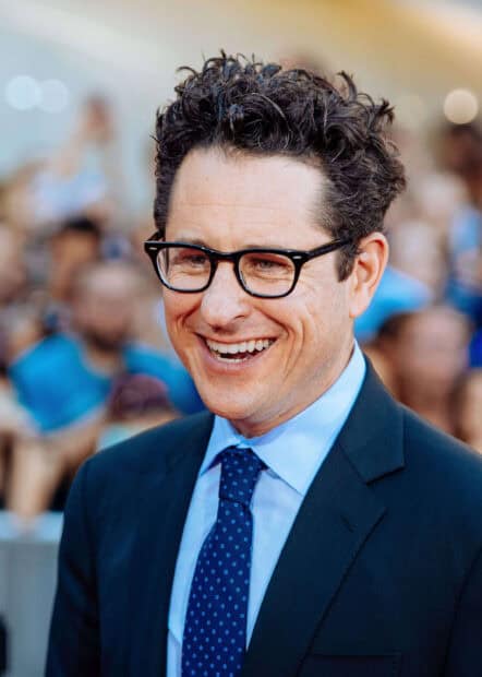 Jj Abrams is wearing glasses and a blue suit while smiling at an event, 2K Mobile Wallpaper