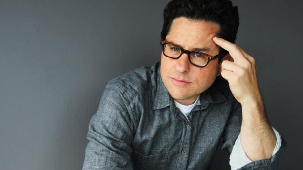Jj Abrams is wearing glasses and resting his finger on his forehead in this portrait, HD Desktop Wallpaper