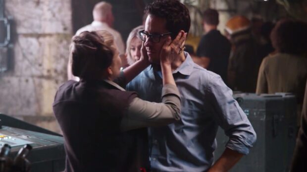 A woman gently holds a man's face on a busy set scene with Jj Abrams Wallpapers HD, HD Desktop Wallpaper