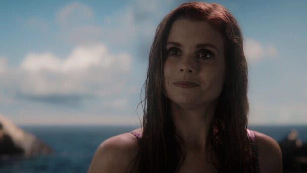 Joanna Garcia Swisher smiles gently with a sea background and cloudy sky, HD Desktop Wallpaper
