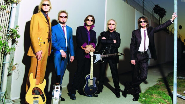 Joe Perry Wallpapers showing the band members standing with instruments in vibrant suits, HD Desktop Wallpaper