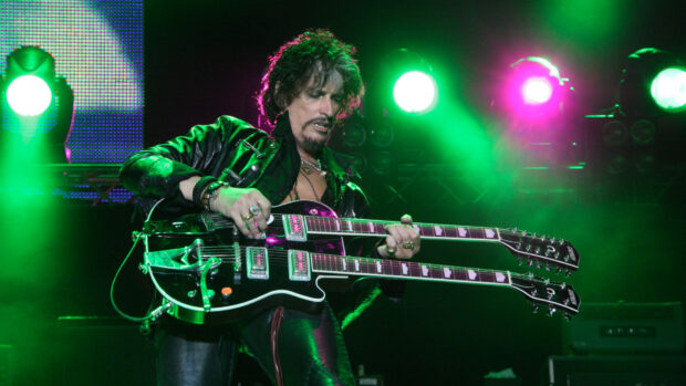 Joe Perry is performing on stage with a double neck guitar under green lights, HD Desktop Wallpaper