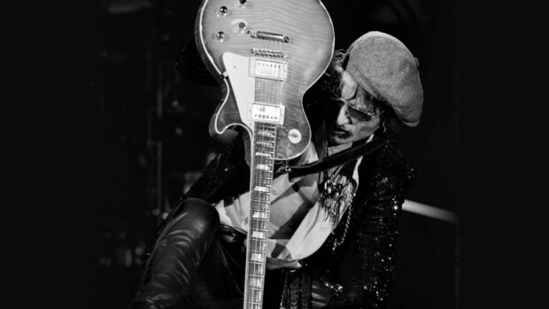 Joe Perry passionately plays guitar during a live concert performance, HD Desktop Wallpaper