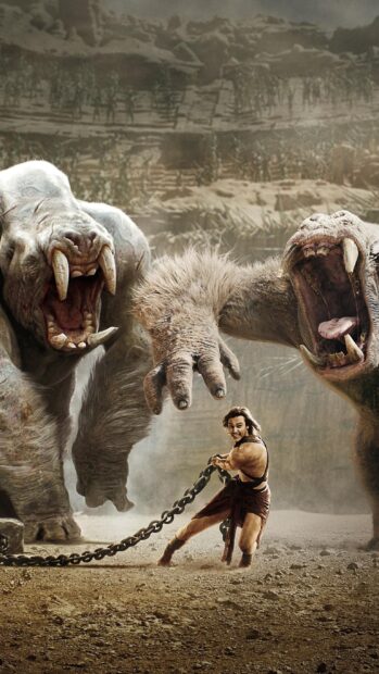 John Carter is battling two massive creatures in a barren arena, 2K Mobile Wallpaper