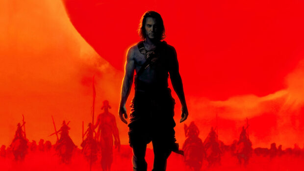 A strong silhouette of John Carter standing before a group of warriors against a vivid orange and red sky, HD Desktop Wallpaper