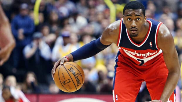 John Wall dribbling the basketball on court focused on the play, HD Desktop Wallpaper