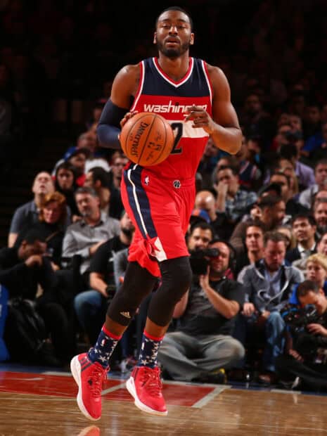 John Wall is dribbling the basketball during a game wearing his Washington jersey, 2K Desktop Wallpaper