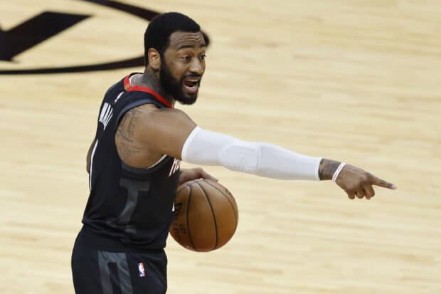 A basketball player John Wall is directing his teammates during a game, 2K Desktop Wallpaper
