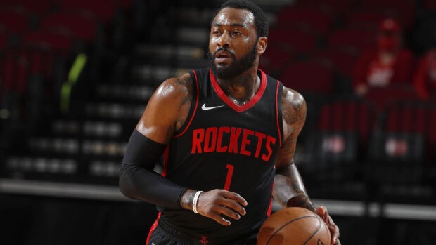 John Wall is dribbling the basketball during a game for the Rockets team, HD Desktop Wallpaper