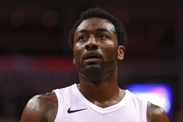 John Wall is captured with intense focus during a game, HD Desktop Wallpaper