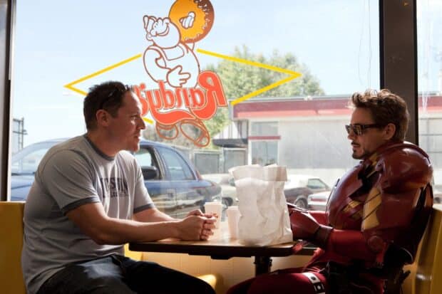 Jon Favreau is sitting across from Iron Man in a diner having a conversation, HD Desktop Wallpaper