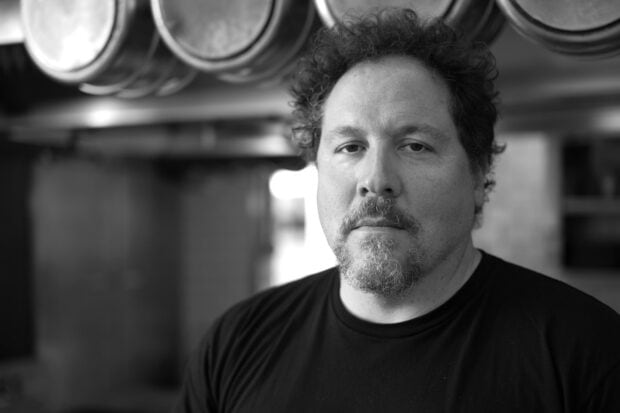 A close up black and white portrait of Jon Favreau looking at the camera, HD Desktop Wallpaper