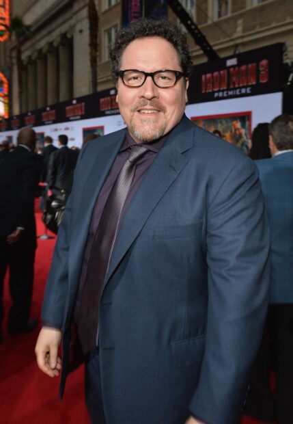 Jon Favreau attends a premiere event in a dark blue suit and glasses, 2K Mobile Wallpaper
