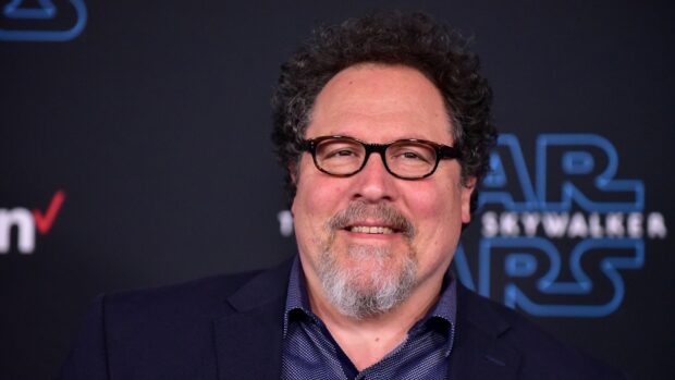 Jon Favreau is smiling while wearing glasses and a dark suit jacket, HD Desktop Wallpaper