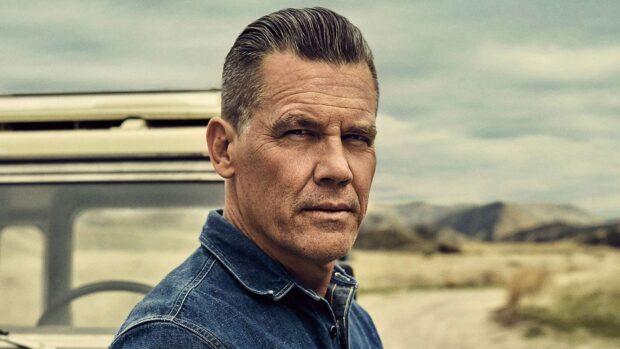Josh Brolin is wearing a denim shirt standing outdoors by a vehicle, HD Desktop Wallpaper