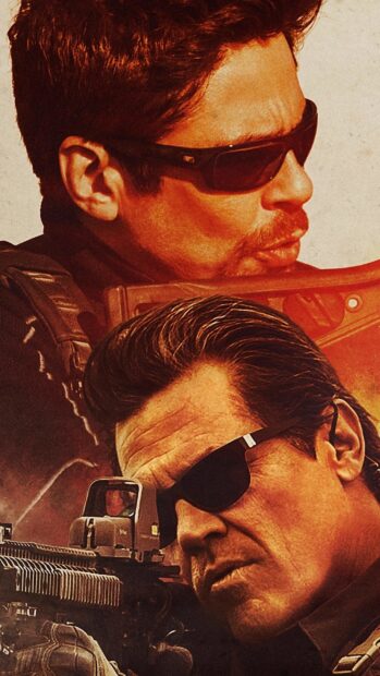 Josh Brolin is wearing sunglasses and aiming with a gun in this intense scene, 2K Mobile Wallpaper