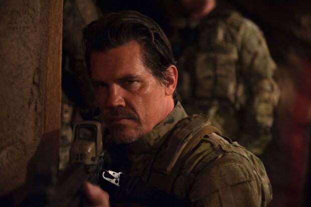 Josh Brolin in military gear aiming a weapon in a tense moment, 2K Desktop Wallpaper