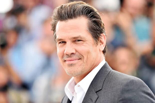 Josh Brolin stands wearing a suit in a public event setting, HD Desktop Wallpaper