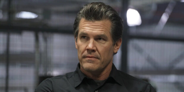 Josh Brolin with a serious expression wearing a dark shirt in an indoor setting, 2K Desktop Wallpaper
