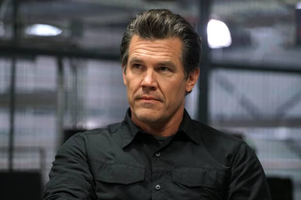 Josh Brolin wears a black shirt with a focused expression, 2K Desktop Wallpaper