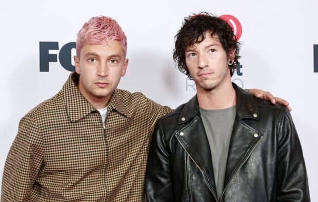 Josh Dun poses with a friend wearing a leather jacket and checkered coat, HD Desktop Wallpaper