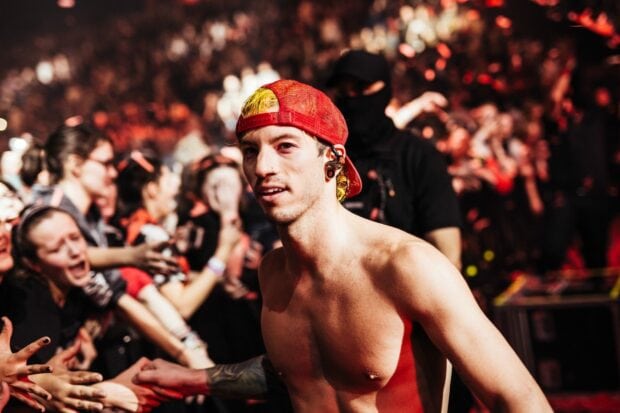 Josh Dun is pictured interacting with fans during a concert, HD Desktop Wallpaper