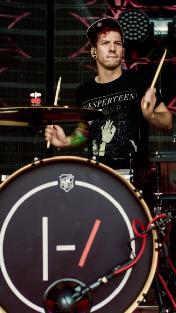 Josh Dun is focused while playing drums on stage during a live performance, HD Mobile Wallpaper