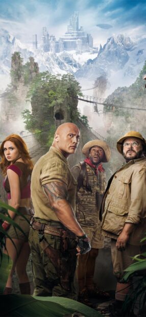 The main characters stand ready amidst a jungle and mountainous landscape in Jumanji The Next Level, 2K Mobile Wallpaper