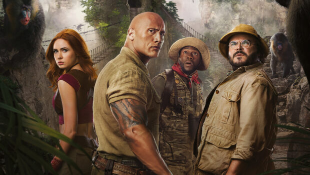 The characters in Jumanji The Next Level stand ready in a jungle setting, 2K Desktop Wallpaper