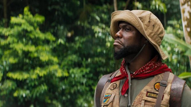A man wearing a hat and vest stands in a jungle in Jumanji The Next Level, HD Desktop Wallpaper