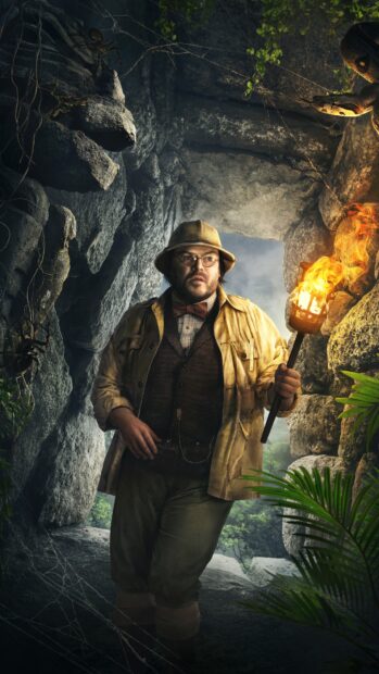 A man holding a flaming torch explores a rocky cave in Jumanji The Next Level wallpapers, 4K Phone Wallpaper