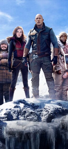 The Jumanji The Next Level characters stand together on a snowy mountain with determined expressions, 2K Phone Wallpaper