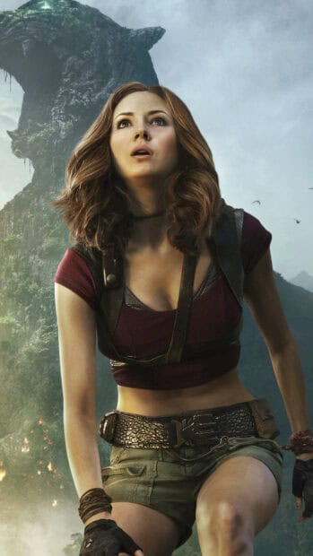 A female character is shown outdoors in Jumanji The Next Level with a large mountain in the background, HD Phone Wallpaper