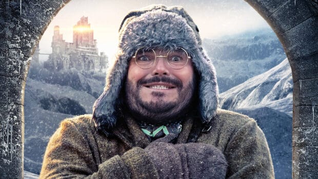 A man wearing a fur hat smiles in a snowy mountainous landscape with a castle behind, 2K Desktop Wallpaper