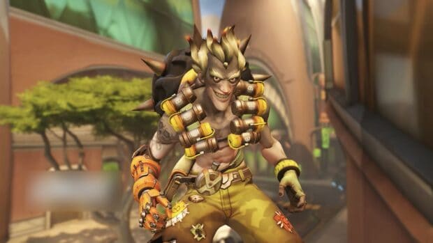 Junkrat character dressed with explosives and mechanical arm in a city scene, HD Desktop Wallpaper