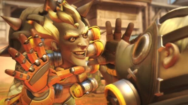 Junkrat smiles with excitement raising his gloved hands in front of a masked character, HD Desktop Wallpaper