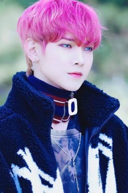 A close up of Kang Yeo Sang with vibrant pink hair and blue eyes wearing a stylish jacket, HD Mobile Wallpaper