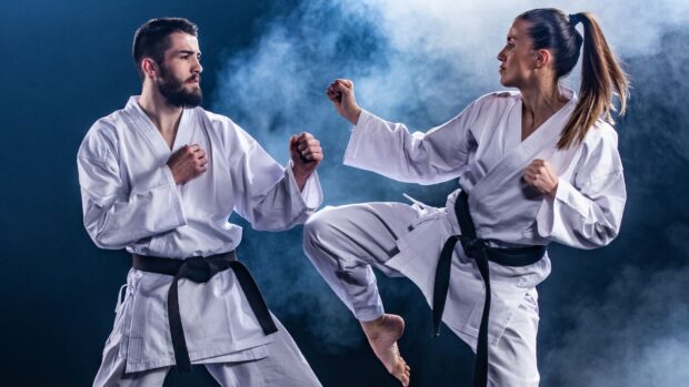 A man and a woman are practicing karate in traditional uniforms with black belts, HD Desktop Wallpaper