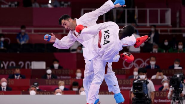 Two karate fighters in full gear competing in a high intensity match, 2K Desktop Wallpaper