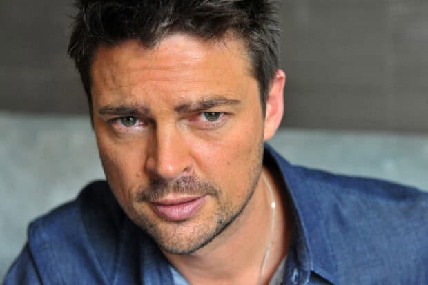 A close up portrait of Karl Urban showing detailed facial features and intense expression, HD Desktop Wallpaper