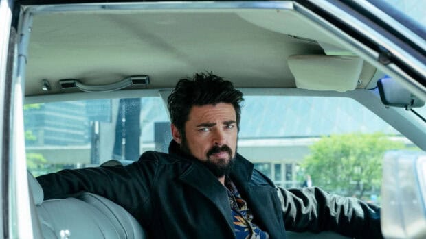 Karl Urban sitting inside a car looking at the camera through the window, HD Desktop Wallpaper