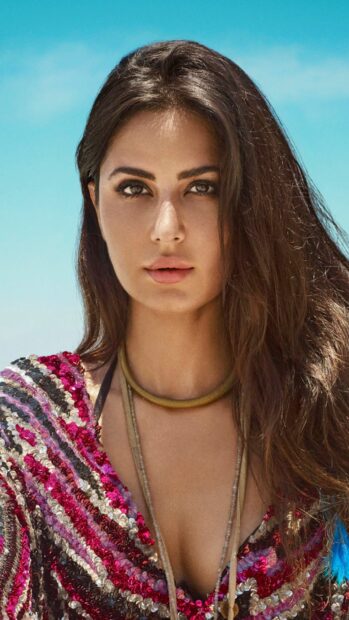 A close up portrait of Katrina Kaif with a blue sky background, HD Phone Wallpaper