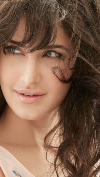 A close up portrait of Katrina Kaif with soft curls and natural makeup, HD Mobile Wallpaper